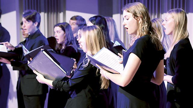 chorus performing on stage