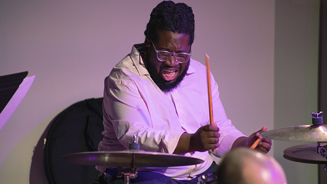 drummer playing a drumset